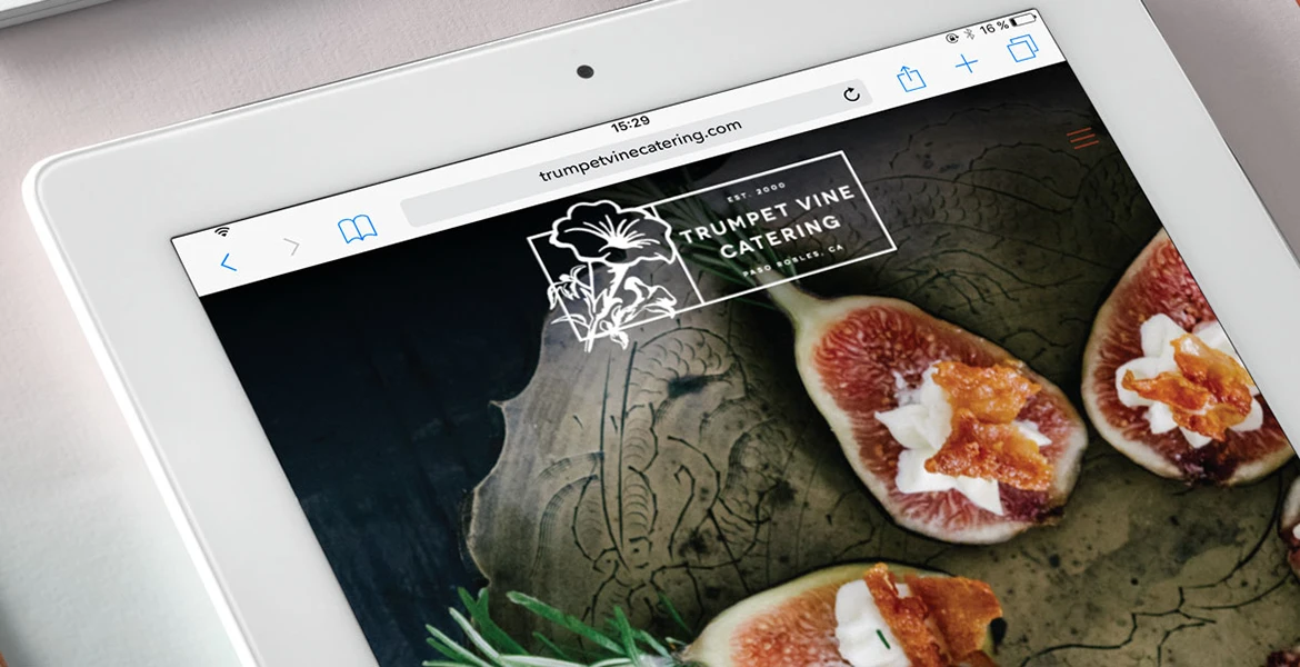 Trumpet Vine Catering website on a tablet